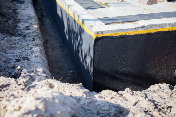 Professional Basement Waterproofing technician working in Phillipsburg, GA